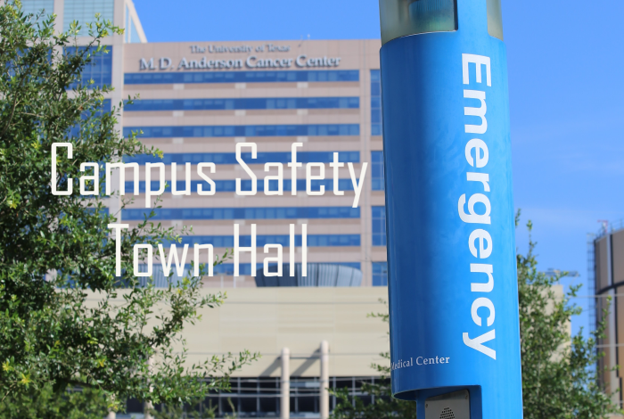 Campus safety town hall in white letters with an MD Anderson building blurred in the background and a blue emergency phone in focus up front