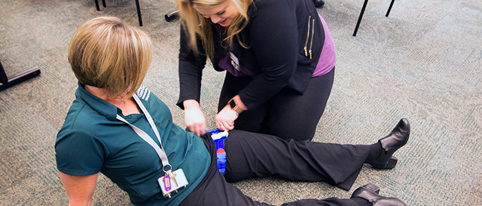 Tourniquet practice during Stop the Bleed training.